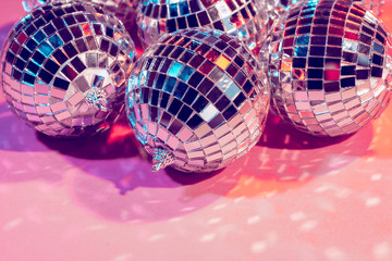 disco ball bauble on pink background.  party concept