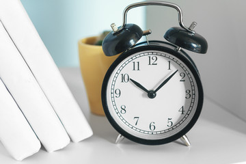 Office interior details with alarm clock and stationery items