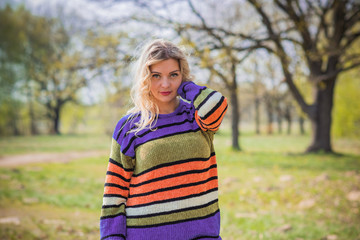 Obraz premium Autumn colorful trendy clothes, fall concept, cozy mood, plus size model in warm clothes 