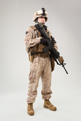 United states Marine Corps special operations command  raider with weapon. Studio shot