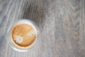 top view cup of coffee espresso with crema on wooden table