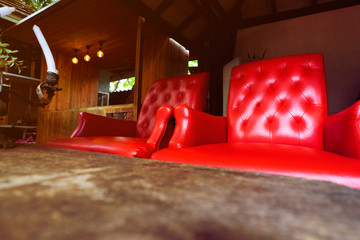 Two Antiques Luxury red chair In a wooden house with Warm sunlight. Like in the olden days