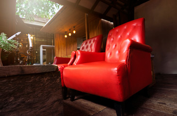 Two Antiques Luxury red chair In a wooden house with Warm sunlight. Like in the olden days
