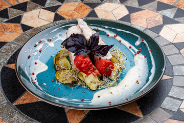 Turkey breast grilled with sliced zucchini and with micro green