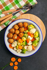Meatballs with broccoli and a cauliflower
