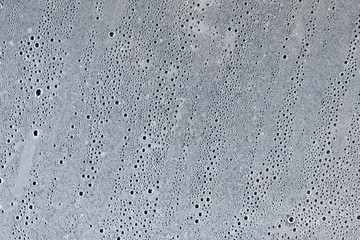 Background of the condensate drops on the film is polyethylene. Water drops texture