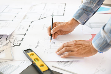 Male architect working in office, closeup