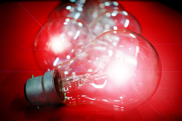 Electric Light Bulbs isolated on Red Background