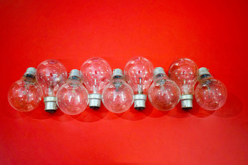Electric Light Bulbs isolated on Red Background