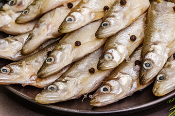 Obraz premium Fresh raw sea fish smelt or sardines ready for cooking