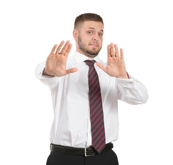 Businessman having panic attack on white background