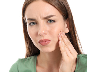 Fototapeta premium Young woman suffering from toothache against white background