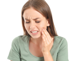 Fototapeta premium Young woman suffering from toothache against white background