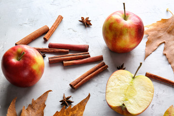 Aromatic cinnamon with anise and apple on grunge background
