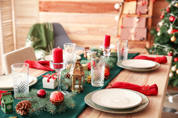 Festive table setting for Christmas dinner at home