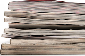 selective focus of the stacking magazine place on white background