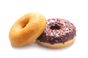 Sweet tasty donuts on white background
