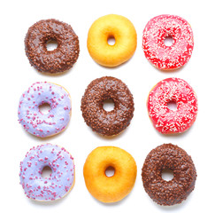 Sweet tasty donuts on white background