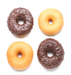 Sweet tasty donuts on white background