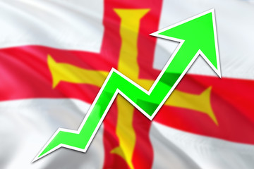 Guernsey economy graph is indicating positive growth, green arrow going up with trend line. Business concept on national background.