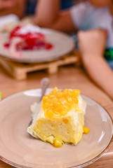 Traditional Slovenian dessert made of dough, cheese and fruit. Dumplings with mango for a delicious breakfast in a European cafe.