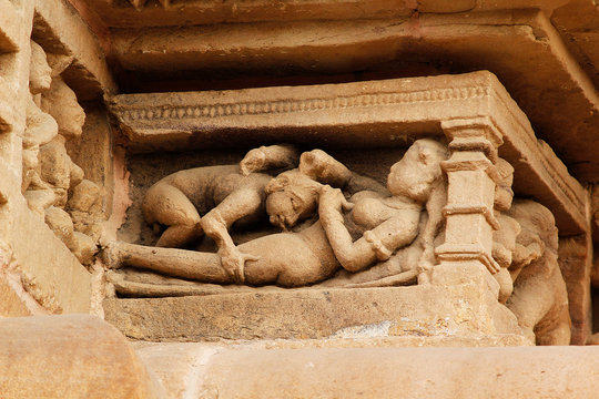 Close up of Kamasutra Pose/scenes on the wall of Hindu temple in Western Group of Temple Khajuraho, Madhya Pradesh