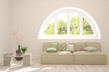 Stylish room in white color with sofa and summer landscape in window. Scandinavian interior design. 3D illustration