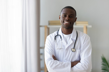 Male african american professional young doctor looking at camera, portrait