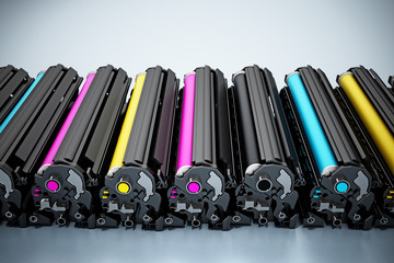 Stack of laser printer CMYK toners. 3D illustration - obrazy, fototapety, plakaty