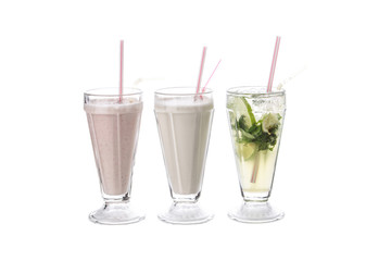 Two milkshakes with stawberry and vanilla flavour and glass of lemonade Isolated on white background