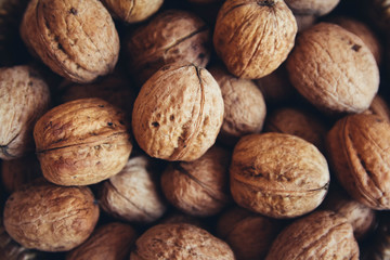 Walnuts on the table close-up. Background with walnuts