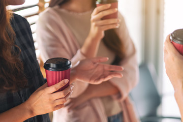 People enjoyed talking and drinking coffee together in office