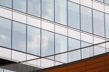 Modern building with windows near railing