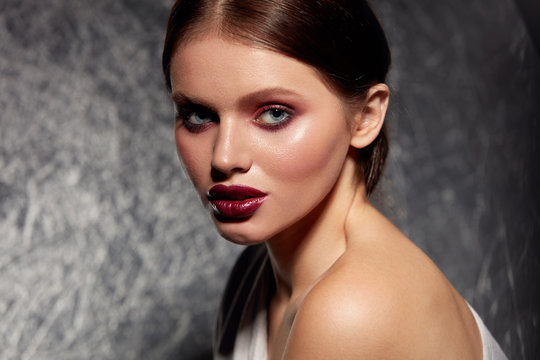 Beauty face makeup. Girl model with glamorous make-up portrait