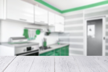 white wooden table top and kitchen interior in neo mint trendy colours. Color of the 2020 year. blurred Modern home interior