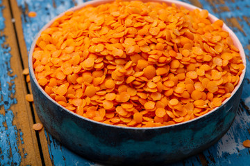 Source of proteins, vegetarian food, red lentils legumes close up