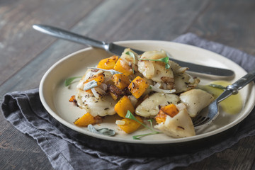 Ravioli, pelmeni, dumplings, pierogi, with pumpkin and fried onions