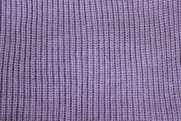 stack of cozy knitted sweaters on wooden background. Autumn-winter concept,Knitted wool sweaters. Pile of knitted winter clothes on marble background, sweaters, knitwear, space for text