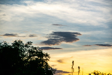 Sunset And a gray cloud with a blue sky