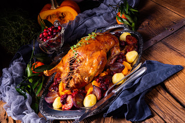 roast duck with potato dumplings and plums