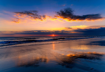Magic Dramatic Unreal Sunset in Seminyak beach, Bali, Indonesia