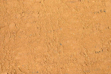 Textured sand surface as background, top view