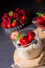 delicious milk rice with different berries and red fruit jelly