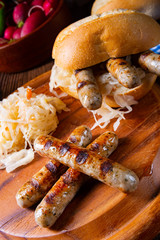rustic Thuringian bratwurst with sauerkraut and roll