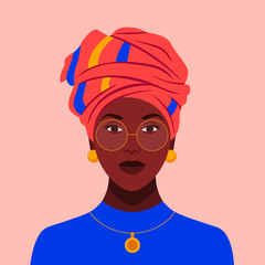 African woman in glasses and a traditional headdress. Avatar of a girl with a scarf on her head  for a social network. Portrait. Vector flat illustration