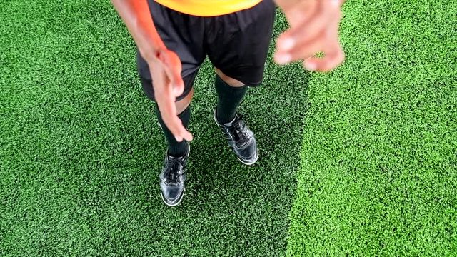 Slow Motion Shot of Referee throws coin to determine the team.