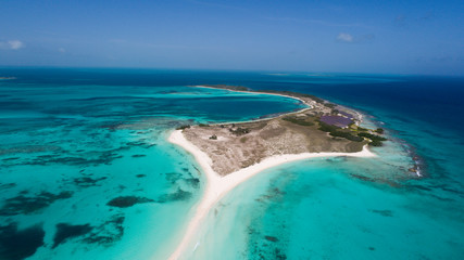Caribbean: Vacation in the blue sea and deserted islands. Aerial view of a blue sea with crystal water. Great landscape. Beach scene. Aerial View Island Landscape Los Roques