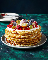 russian waffle cake with sour cream and berries