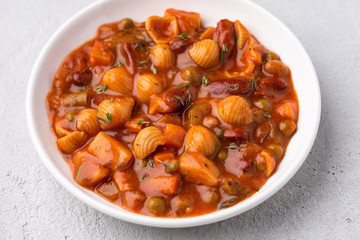 vegetable grains peas soup in tomato sauce