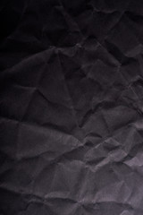 Crumpled black paper